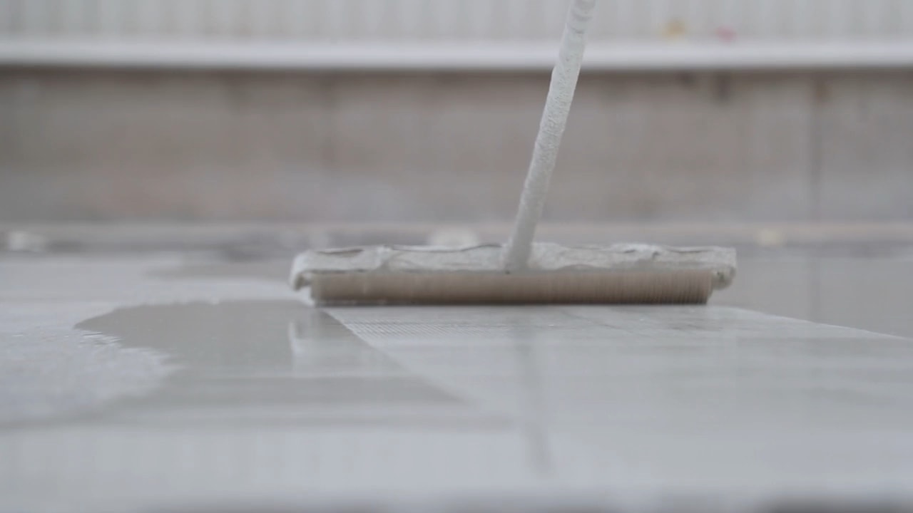 Polyurea spray coating being applied to an industrial surface